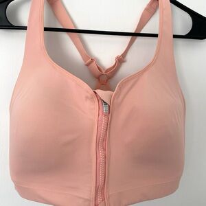 Athleta zip front sports bra size 36DD in light peach color